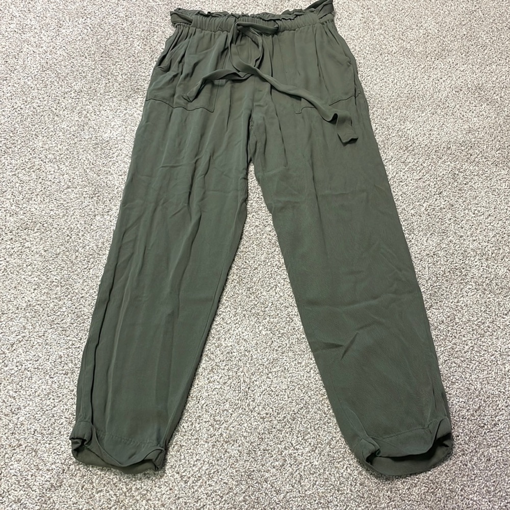Know One Cares green trash bag pants
